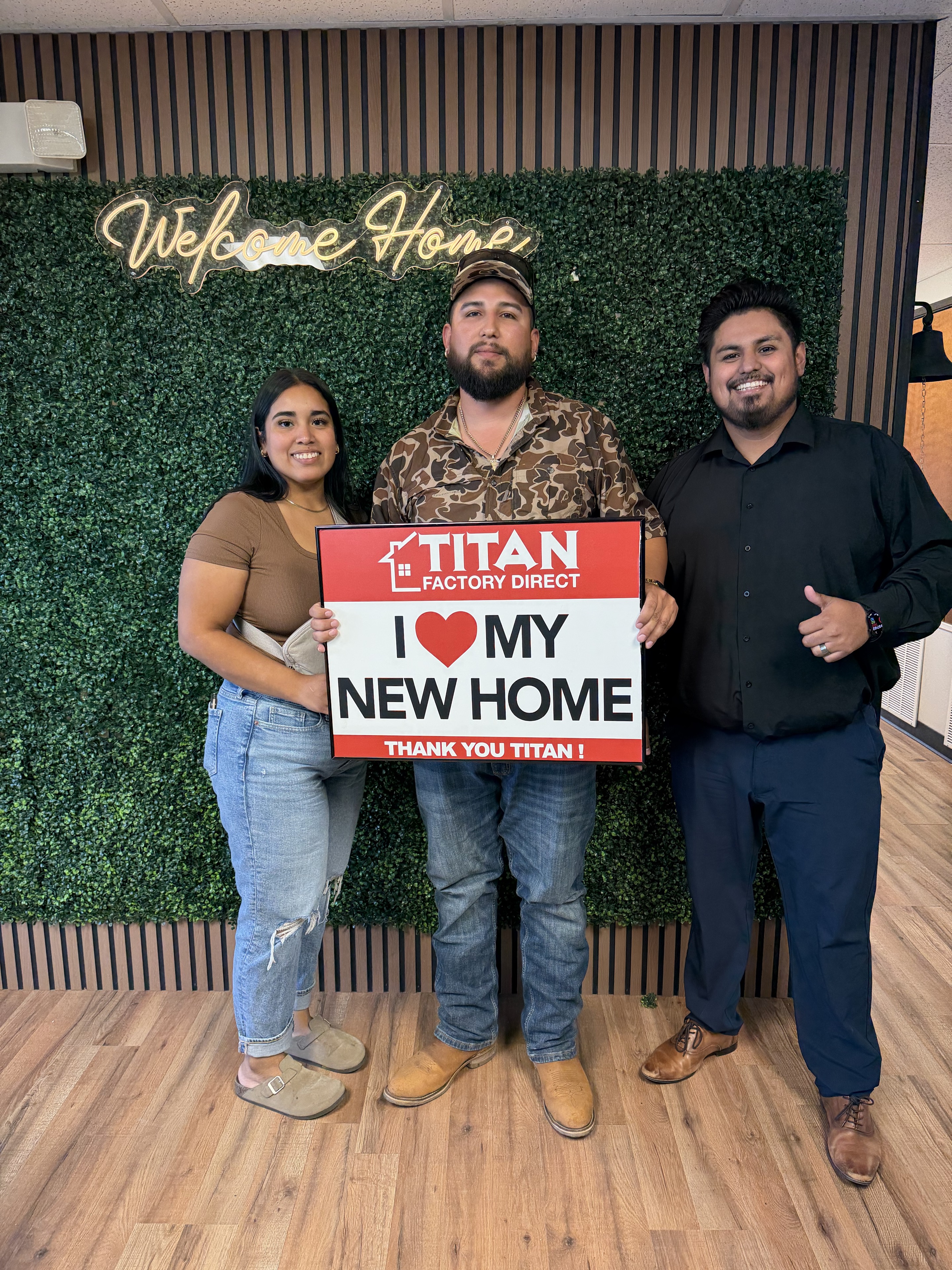 Kevin with homebuyers celebrating their new home at Titan Factory Direct